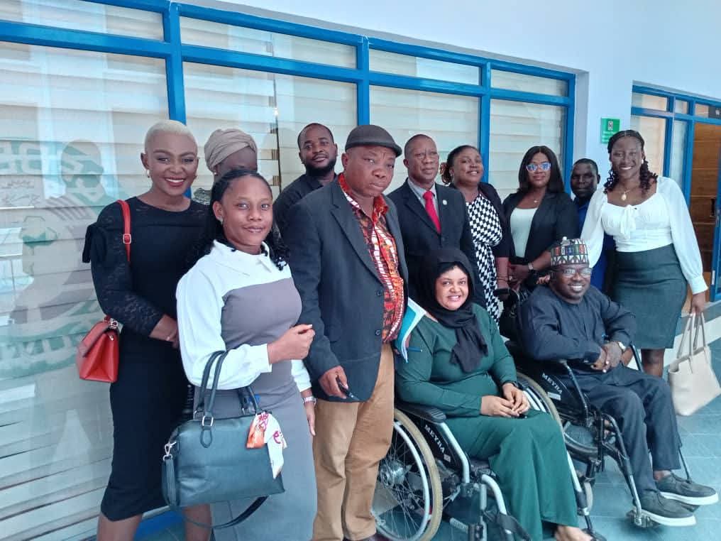 GDGI representatives, including two wheelchair users, meeting with ECOWAS Commission staff