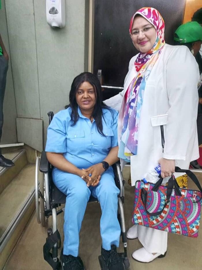 A GDGI advocate in conversation with a healthcare professional
