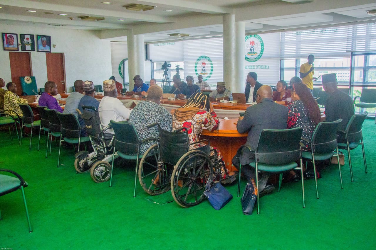 A speaker addressing the stakeholders' meeting
